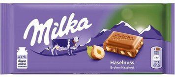 Шоколад молочный с лесными орехами Milka Haselnuss, 100 г, Швейцария 1565092379 фото