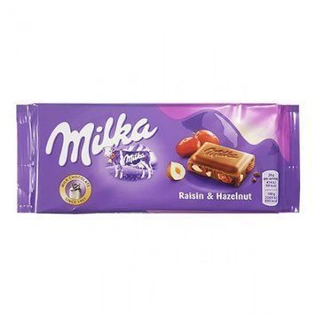 Шоколад молочный с изюмом и лесными орехами Milka Raisin & Haselnut, 100 г, Швейцария 1665992565 фото