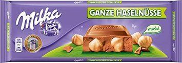 Шоколад молочный с цельными лесными орехами (фундук) Milka Haseln, 270 г 1733953180 фото