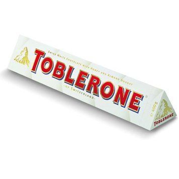 Швейцарский белый&nbsp;шоколад Toblerone с изюмом, нугой из меда и миндальным орехом, 100 г 1385930285 фото