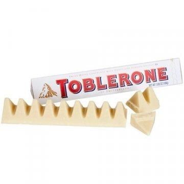 Швейцарский белый&nbsp;шоколад Toblerone с изюмом, нугой из меда и миндальным орехом, 100 г 1385930285 фото