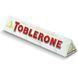 Швейцарский белый&nbsp;шоколад Toblerone с изюмом, нугой из меда и миндальным орехом, 100 г 1385930285 фото 1